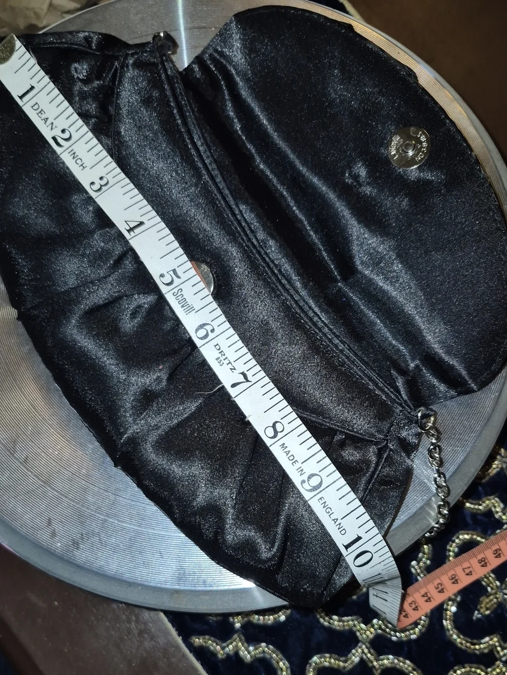 Vintage: A black satin foldover evening bag. Satin Bow& Rusch Pleating &tassels